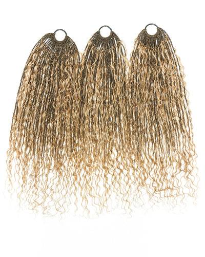 Three blonde hair extensions with wavy texture on a white background